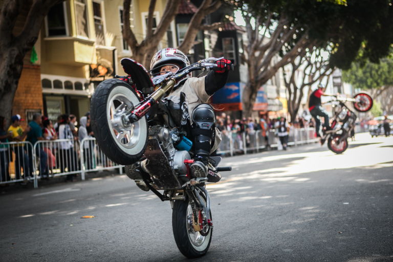 The 8-year-old stunt rider, AJ Stuntz performs tricks and stunts during the 38th Annual Carnaval San Francisco grand parade on 24th Street in San Francisco's Mission District, Sunday, May 29, 2016. (Photo by Ekevara Kitpowsong)