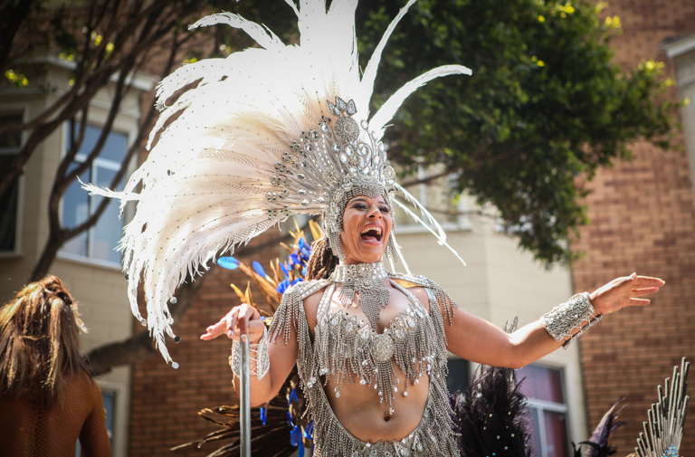 A Carnaval participant performs on the float during the 38th Annual Carnaval San Francisco grand parade on 24th Street in San Francisco's Mission District, Sunday, May 29, 2016. (Photo by Ekevara Kitpowsong)