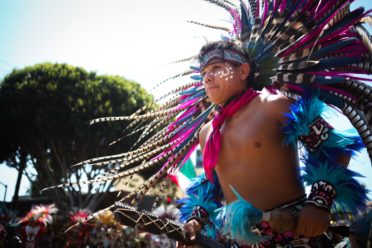 Aztec dancer performs in the 38th Annual Carnaval San Francisco grand parade on 24th Street in San Francisco's Mission District during Memorial Day weekend, Sunday, May 29, 2016. (Photo by Ekevara Kitpowsong)