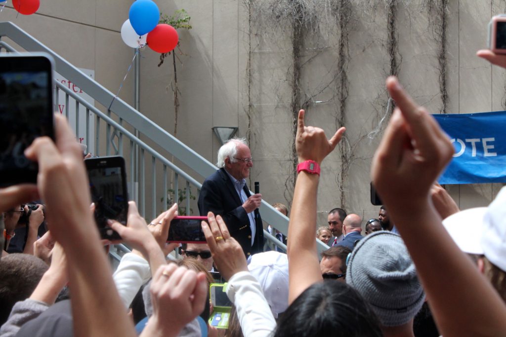 -Senator Bernie Sanders smiles as supporters applaud his arrival at City College's Mission center on Monday, June 6, 2016. (Photo by Audrey Garces/The Guardsman)