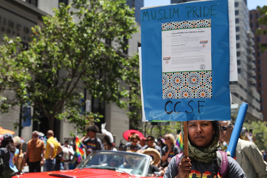 City College professor of Middle East Studies Neela Chatterjee holds a sign that reads Muslim Pride at the San Francisco Pride Parade on June 26, 2016. (Photo by Cassie Ordonio/The Guardsman) 
