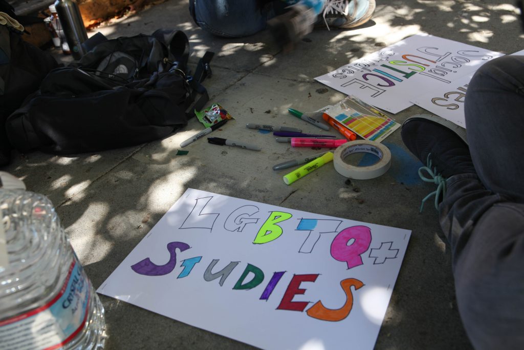 City College faculty create signs before the San Francisco Pride Parade to support the Interdisciplinary Studies program on June 26, 2016. (Photo by Cassie Ordonio/The Guardsman)