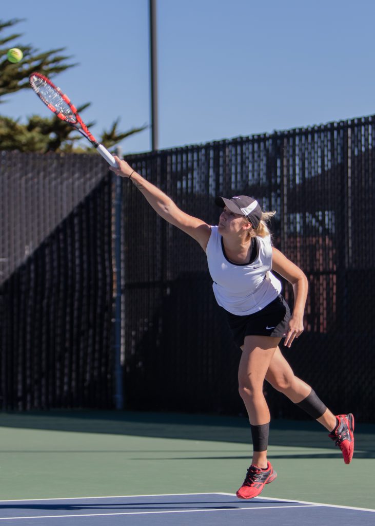 Sophomore Emma Stoep serves during a meet against Chabot College on March 1, 2016. (Photo by Peter Wong/Special to The Guardsman)