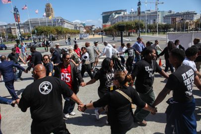 Demonstrators join indigenous dancers in front of San Francisco's City Hall in support of a memorial resolution for Alex Nieto on September 13, 2016. (Photo by Cassie Ordonio/ The Guardsman