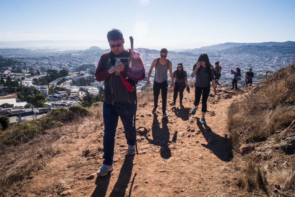 From Left to right: Eason Lin, Elson Law, Toni Rose Babasoro, Cordelia Carlisle, Carla Hovde, Ankita Sethi, Richard Deamicis on their way up Mt. Davidson. San Francisco's Bay in the background on Oct. 8, 2016. Photo by Gabriela Reni/ The Guardsman.