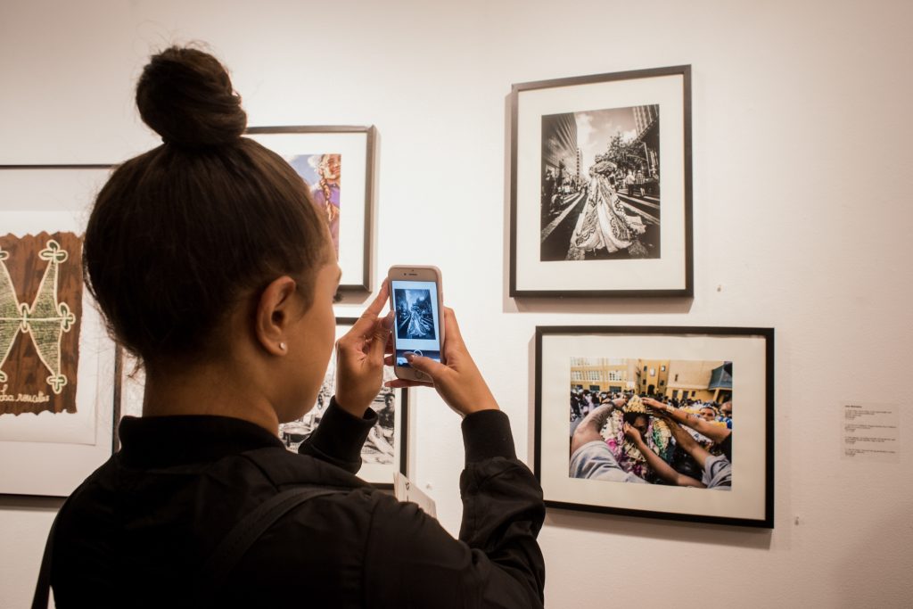 Student documents the event at the Being Pacific opening reception at San Francisco State University on Oct. 13, 2016. Photo by Gabriela Reni/ The Guardsman.