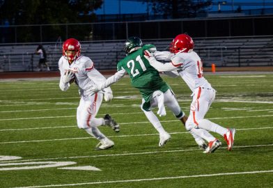 Sophomore wide receiver Erik Phillip (L) with assist from sophomore wide receiver Chikwado Nzerem (R) attempts to run in for a touchdown at Laney College. The Rams eventually lost the game to the Eagles with the final score of 18-13 on September 2, 2016.  File photo Gabriela Reni/The Guardsman