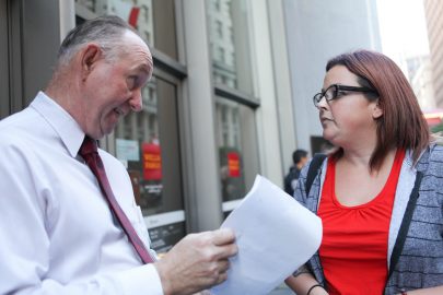 Frank Donahue, Vice President of the Wells Fargo headquarters, tells demonstrator, Mealnie Ramierez he will give the CEO, Tim Sloan the letter in opposition of the bank funding the Dakota Access Pipeline Project on Nov. 9, 2016. (Photo by Cassie Ordonio/The Guardsman)
