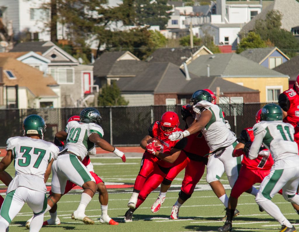 Rams running back Lorenzo Logwood (3) breaks through a tackle during  the San Francisco Community College Bowl at George Rush Staduim on Saturday Deember 3, 2016. Photo by Franchon Smith/The Guardsman