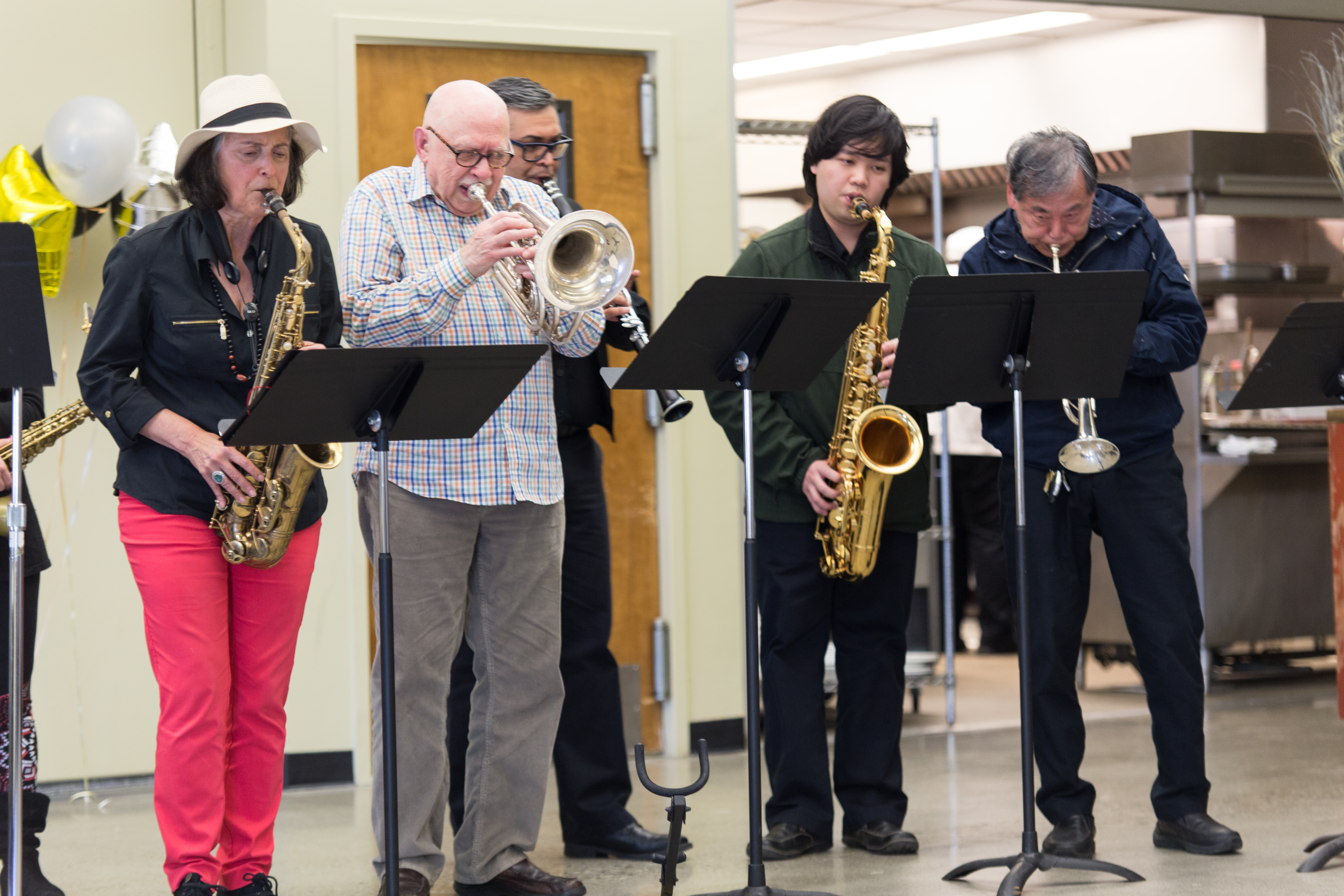  From left to right, Frank Phipps, Van Mares, Ferdinand Hartanto, John Lou and the band performs “When the Saints Go Marching In” by Katharine Purvis and James Milton Black as the opening song in the Pierre Coste Room on Apr. 13, 2017. Photo by John Ortilla/The Guardsman. 