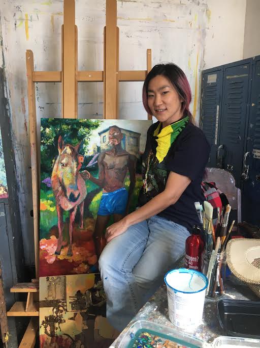  Tsungwei Moo poses next to her painting "Home Sweet Home" featuring her late boyfriend Ricardo Distin on October 2, 2017. Photo by Laurie Maemura. 