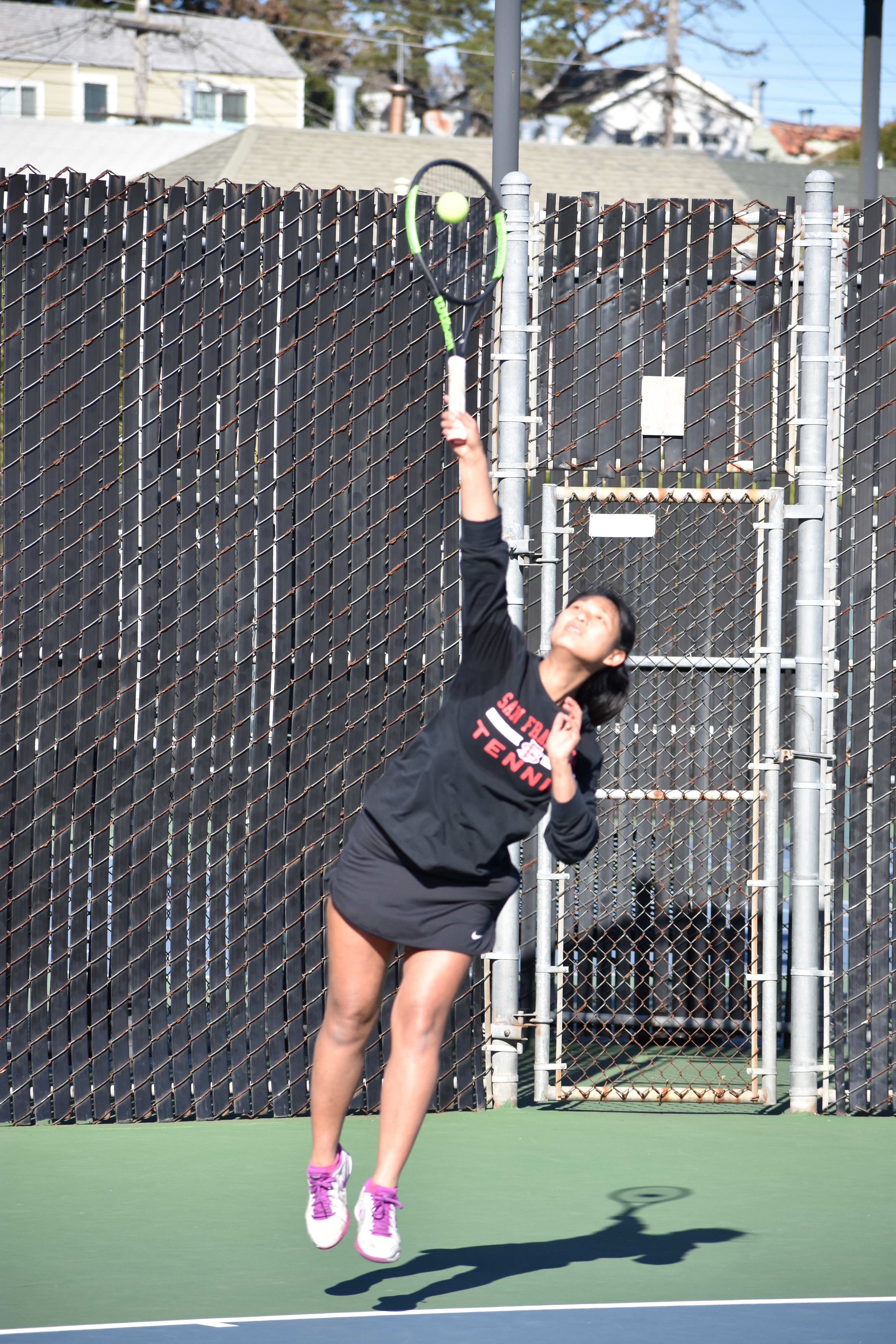 Ram's sophomore No. 2 ranked women's tennis player Yvonne Ng strikes a serve against Cañada College on Feb. 16, 2018. Photo by Veronica Steiner/The Guardsman. 