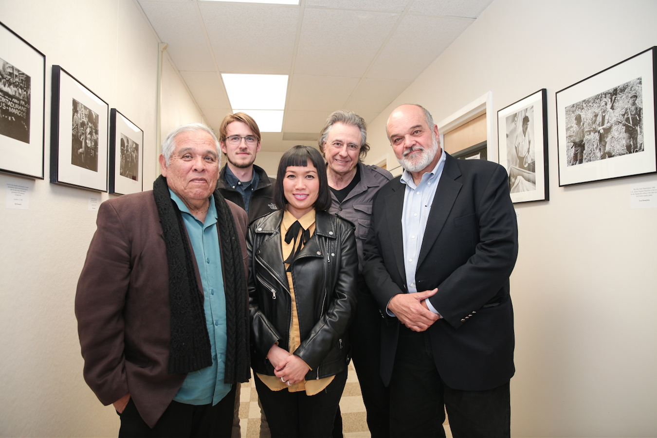 Journalism department chair Juan Gonzales, curator James Fanucchi, curator Ekevara Kitpowsong, former Reuters Photo Bureau Chief Lou Dematteis, and Pulitzer Prize-winning photojournalists Kim Komenich at the opening reception of "In the Line of Fire" on Friday, April 13, 2018. Photo by David Horowitz/Special to The Guardsman. 