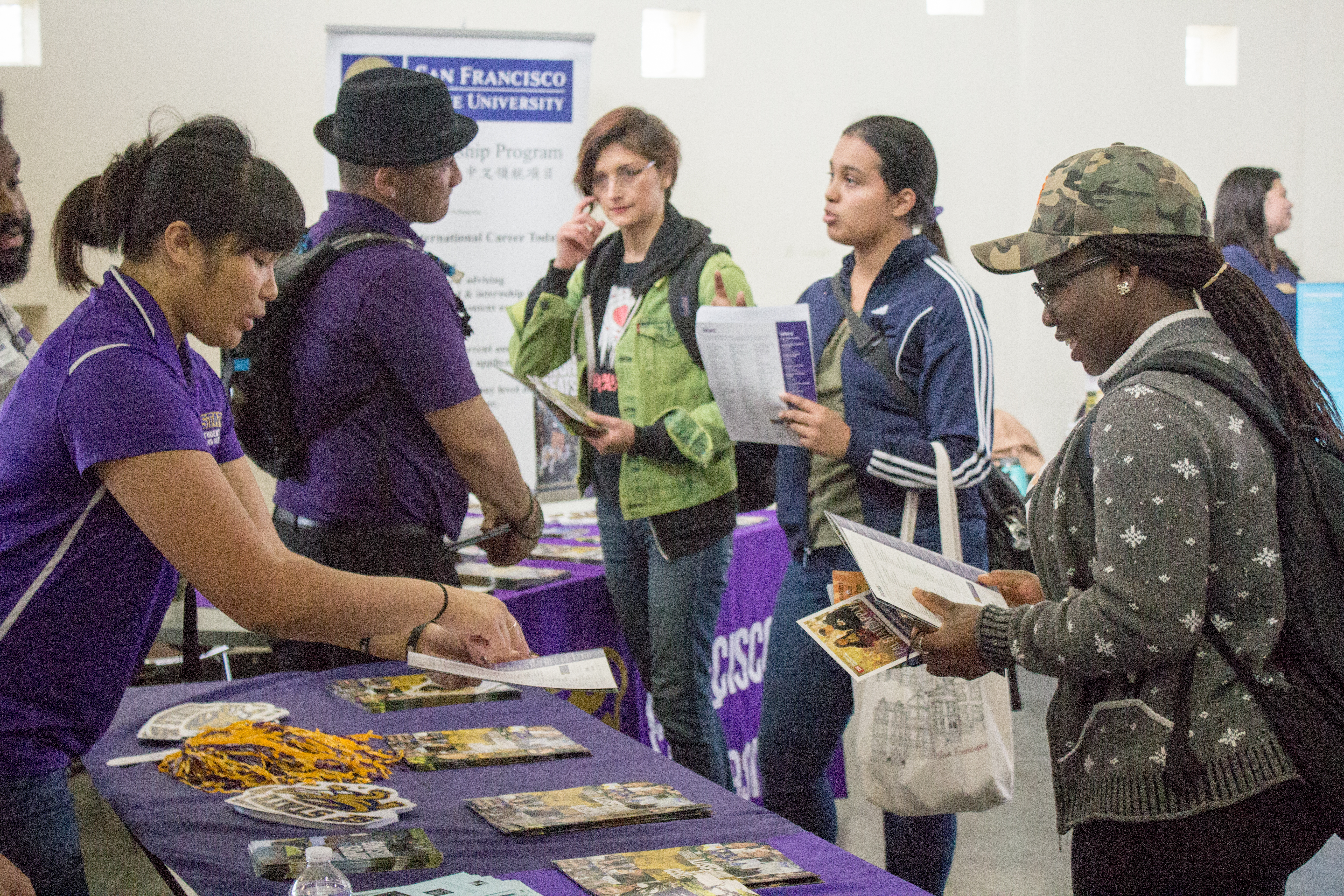 San Francisco State  University Outreach Specialist Tabitha Hurdle, left, provides school information for City College student Stellamaris Nwihim, right. Photo by Peter J Suter/The Guardsman